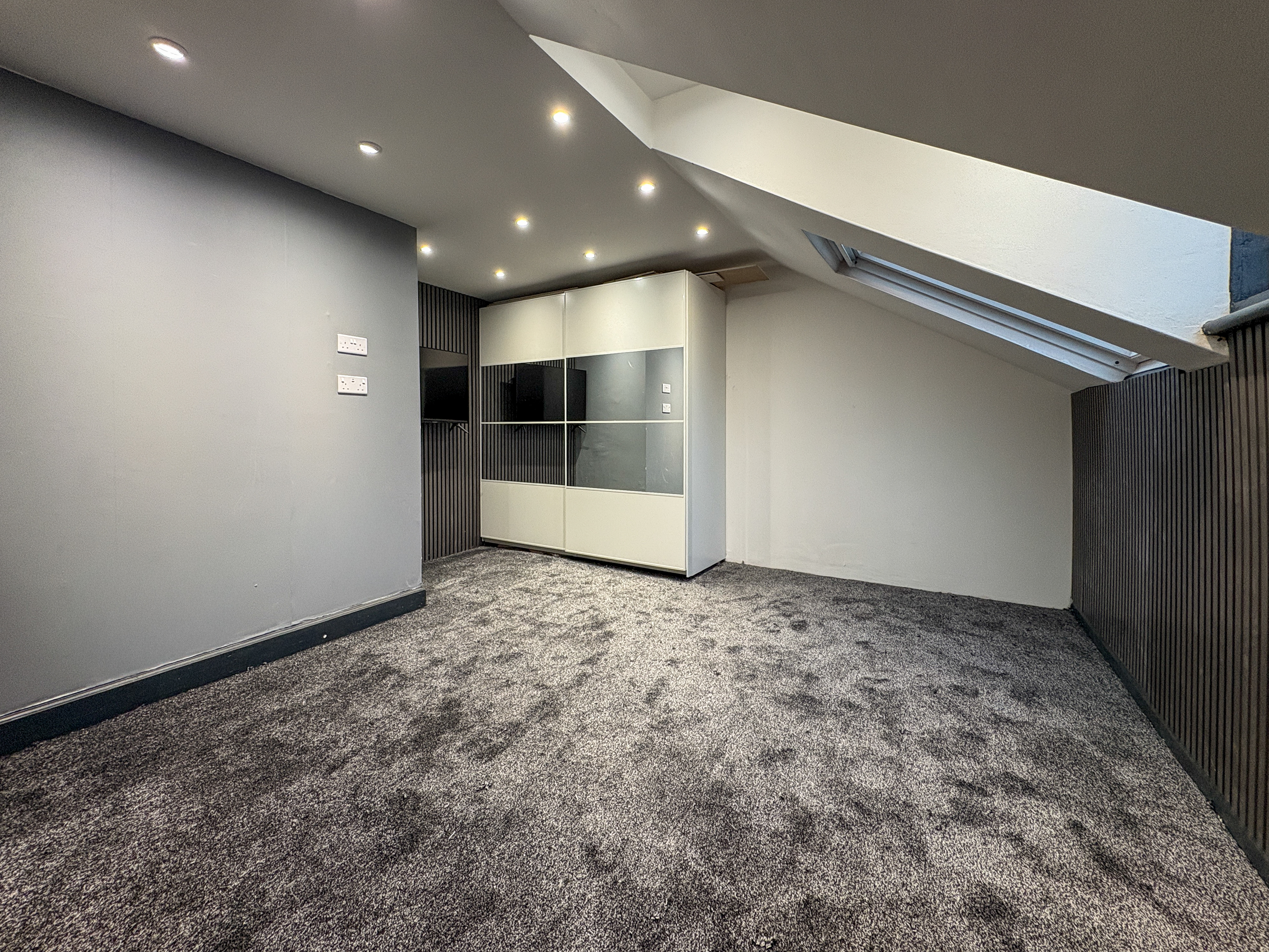 Plush carpet fitted in bedroom by West Yorkshire Carpets